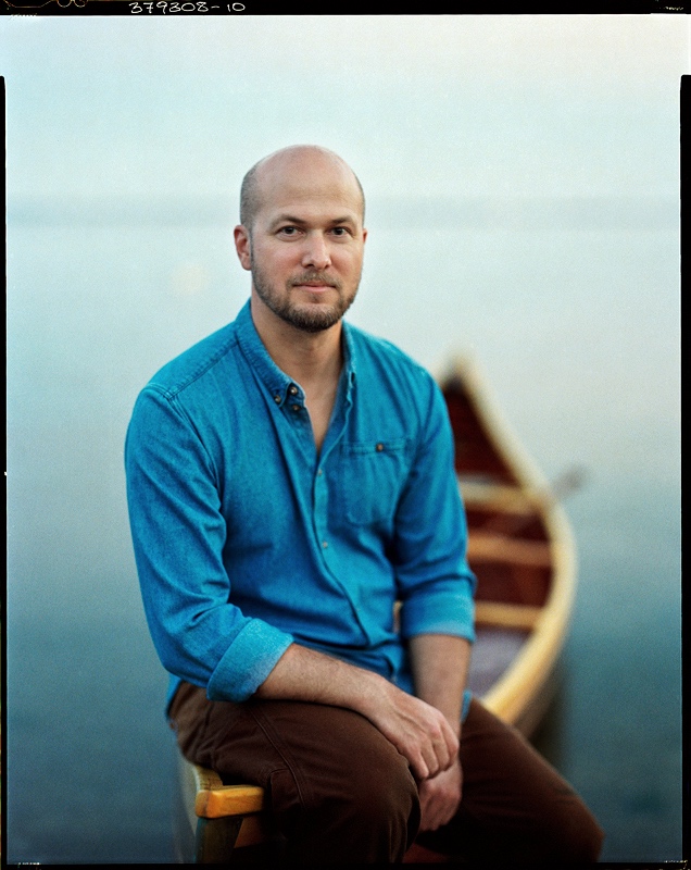 Trent Preszler sitting at the front of one of his conoe's.